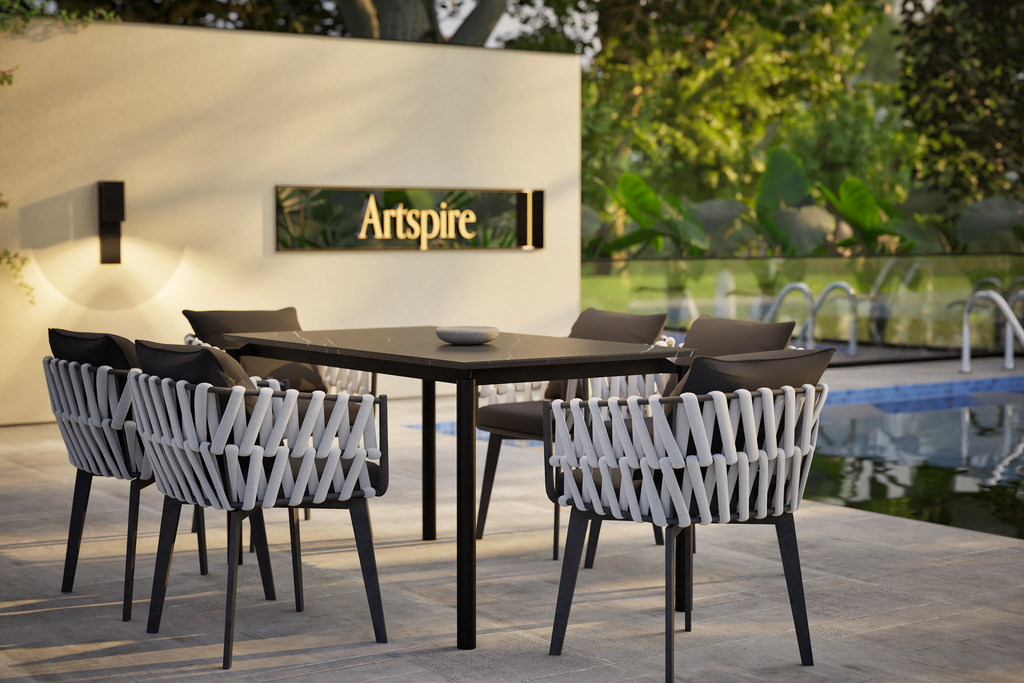 Modern outdoor dining set with rope chairs and black table near pool – stylish outdoor furniture in Australia